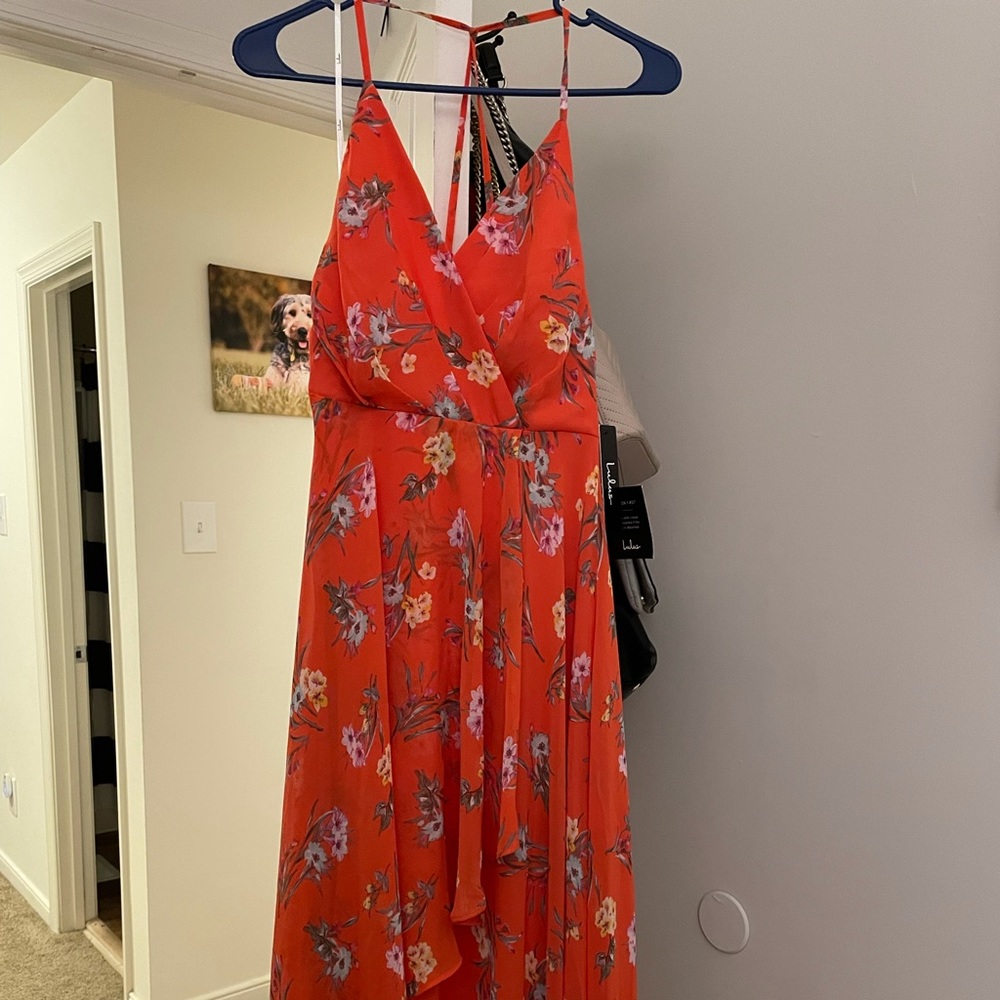 It’s a dark orange floral maxi dress.